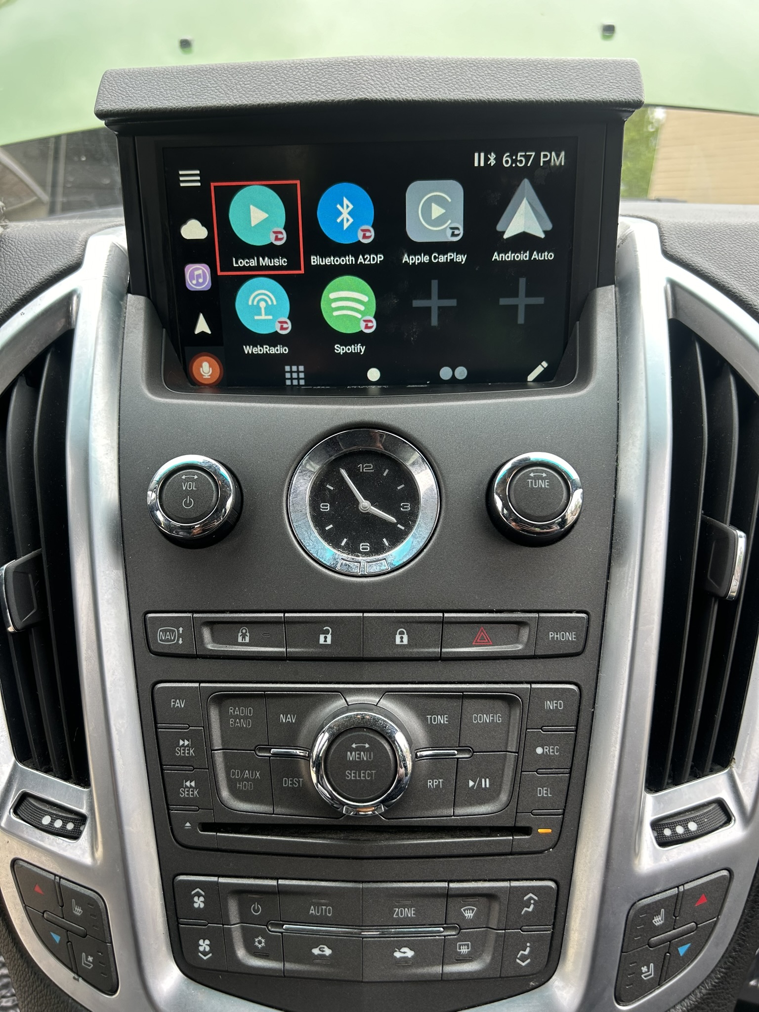 Cadillac SRX factory screen showing CarPlay through an add-on module